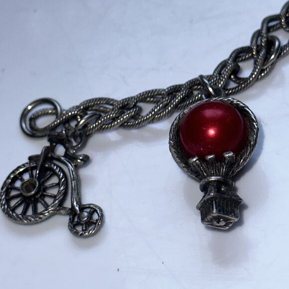 Vintage silver tone charm bracelet featuring modes of travel - Picture 2 of 8